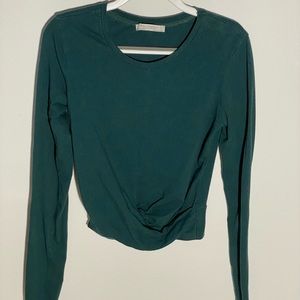 Forrest green Zara long sleeve top with detail at the bottom.